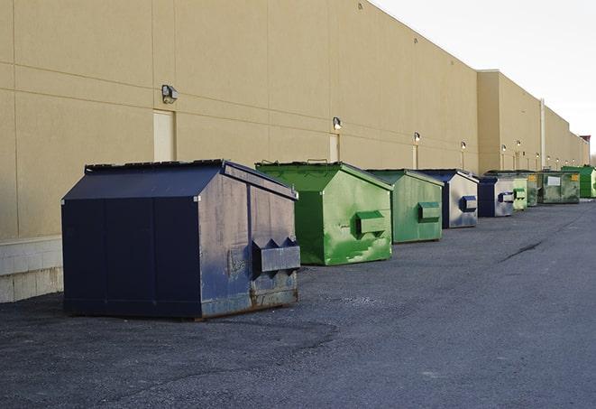 a large dumpster awaits materials from a renovation project in Bossier City